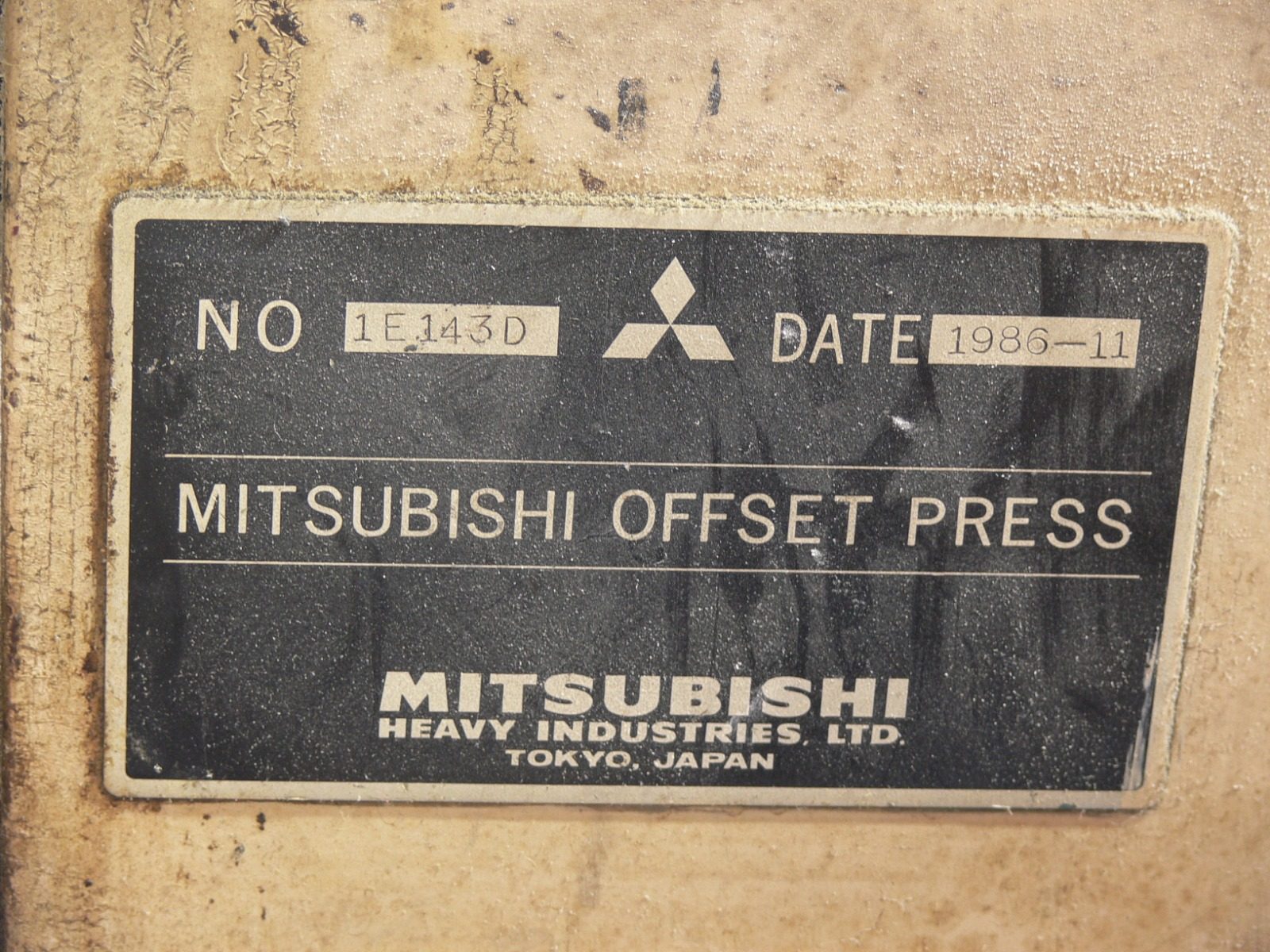 The maker's plate on the press: Mitsubishi Offset Press, Mitsubishi Heavy Industries, Tokyo — dated 1986